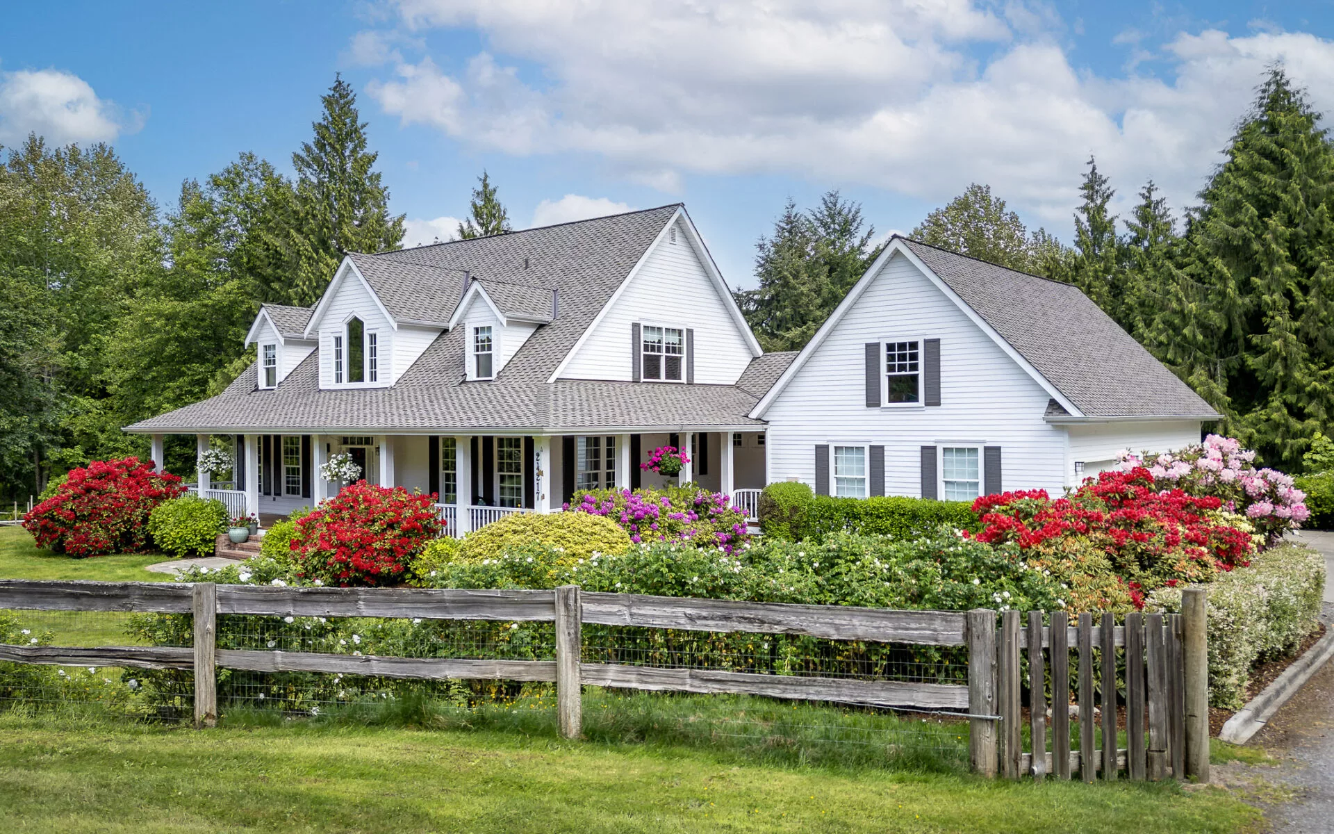 A front exterior photo of a high-end house that was listed by the Cascade Property Advisers.