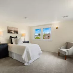 Second of two upstairs guest bedrooms, also with staged furniture.
