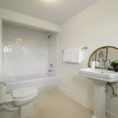 Upstairs bathroom, with restored shower surround and flooring.