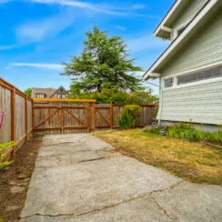 Backyard and driveway, which allows room for RV parking.