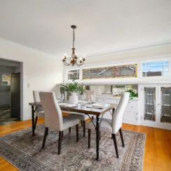 Formal dining, with entryway to the kitchen visible.