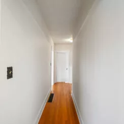 Hallway on the ground floor. Hardwood is restored.