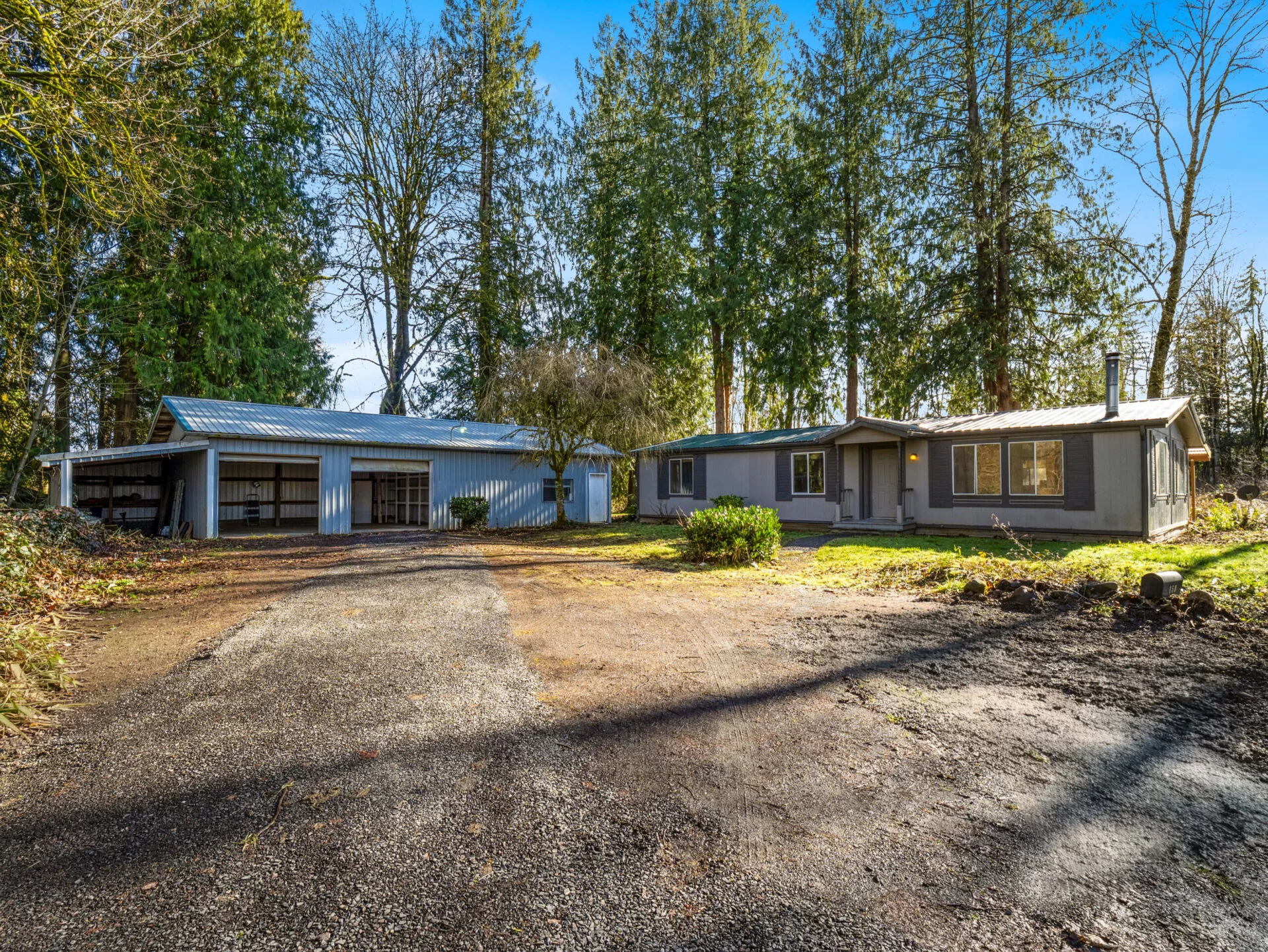 A front-facing photo of the exterior of 150 Jorgensen Rd, a home on acreage and near a river near the town of Onalaska.
