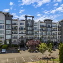 A front-facing photo of the exterior of 320 E 32nd St Unit #105, a modern condominium in East Tacoma.