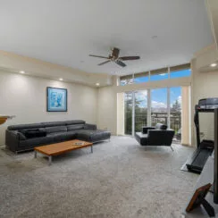 Living room, with a glimpse of the view of downtown Tacoma from the window.