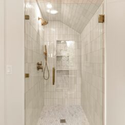High-end materials are visible in the bathroom shower surrond.