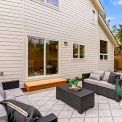 Backyard, with staged furniture on patio.