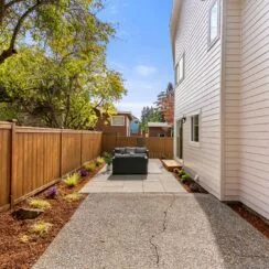 Exterior shot of the home, with another angle of the patio visible.